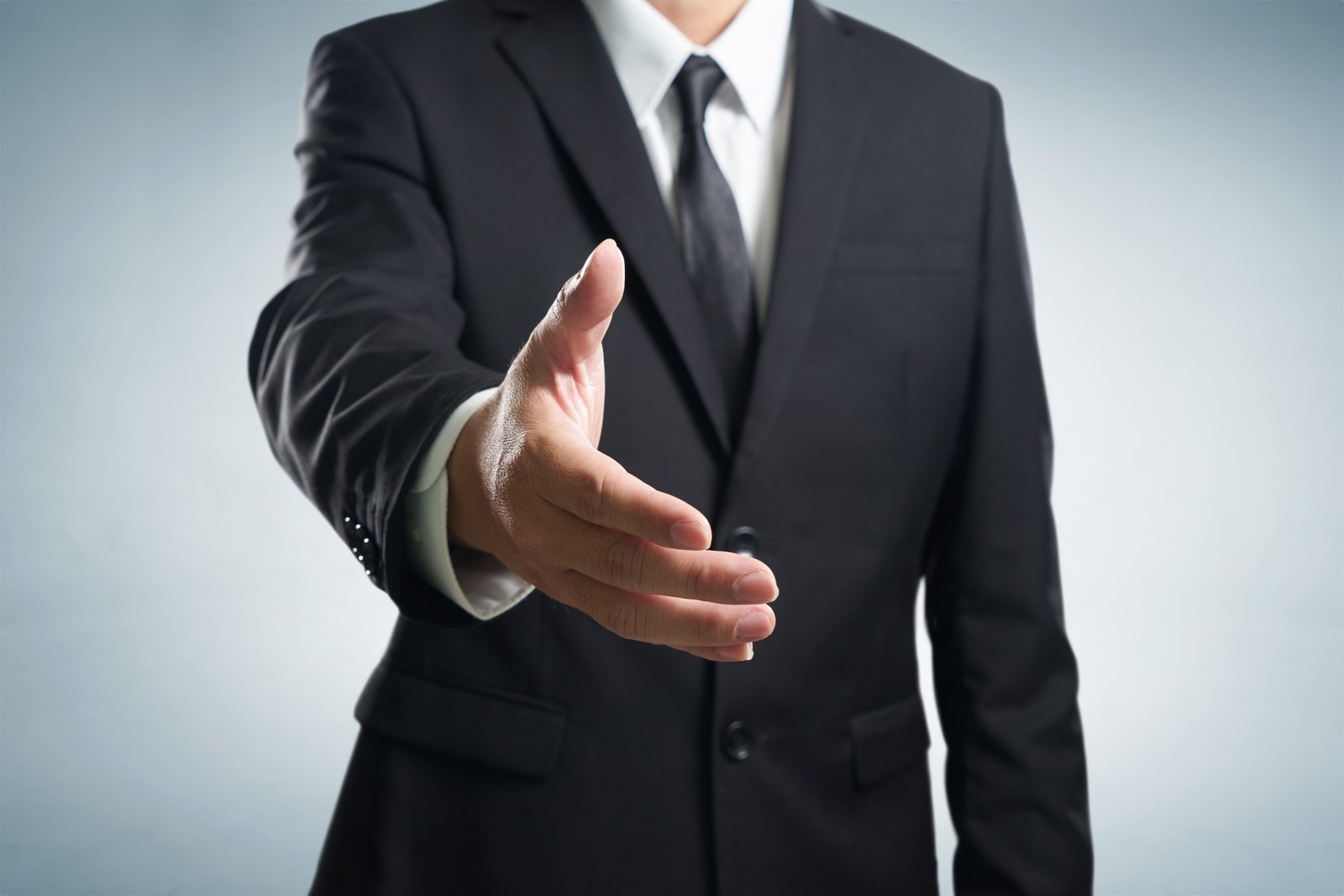 Business man shake contract concept. man in suit reaching out to shake hands